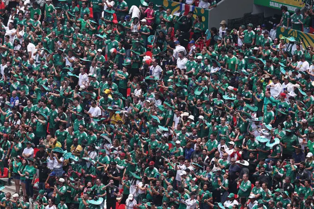 Mexican fans cheer in the stands