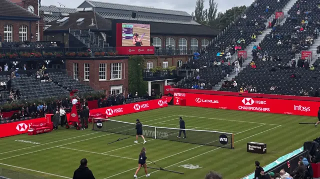 Ground staff work on Andy Murray Arena