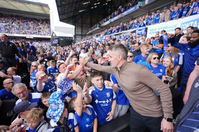 Ipswich Town manager Kieran McKenna celebrates their side’s promotion to the Premier League after the Sky Bet Championship match at Portman Road, Ipswic