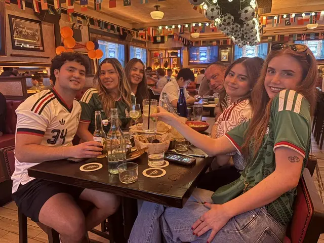 Mexico fans watching along in a sports bar in New York