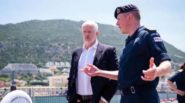 Armed forces minister Al Carns (left) is shown mine detecting equipment during a visit to RFA Lyme Bay in Gibraltar