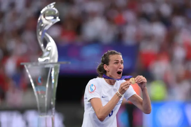 Scott holding her medal in the Euros final