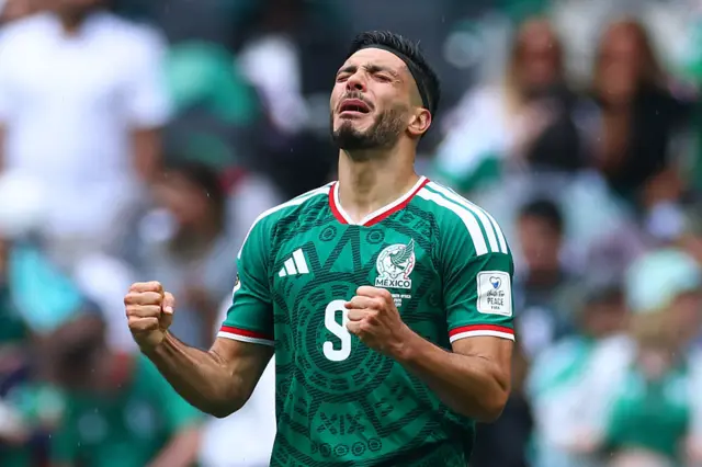 Raul Jimenez holds up his hands to celebrate
