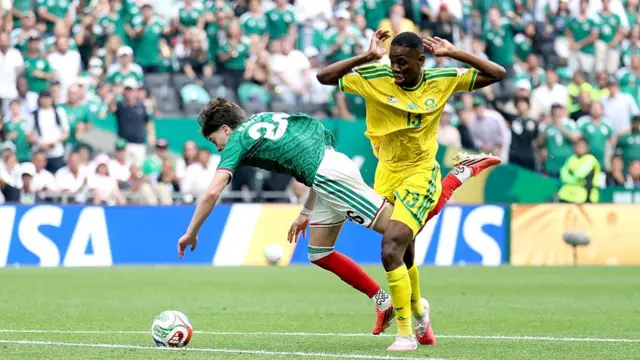 Brian Gutierrez #26 of Mexico is fouled by Sphephelo Sithole #13 of South Africa leading to a red card being shown during the FIFA World Cup 2026 Group A match between Mexico and South Africa at Mexico City Stadium on June 11, 2026 in Mexico City, Mexico.