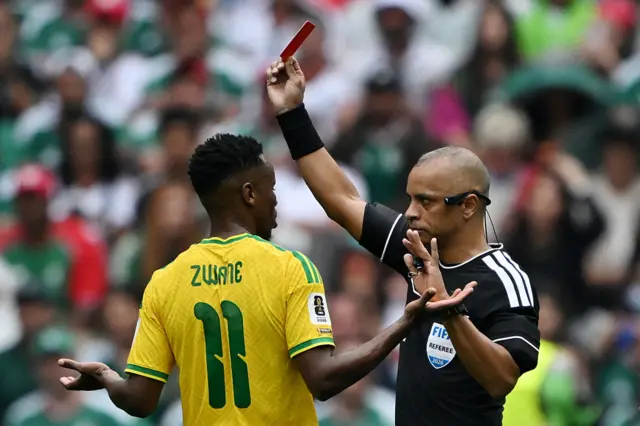 Thamba Zwane is shown a red card by Wilton Sampiao