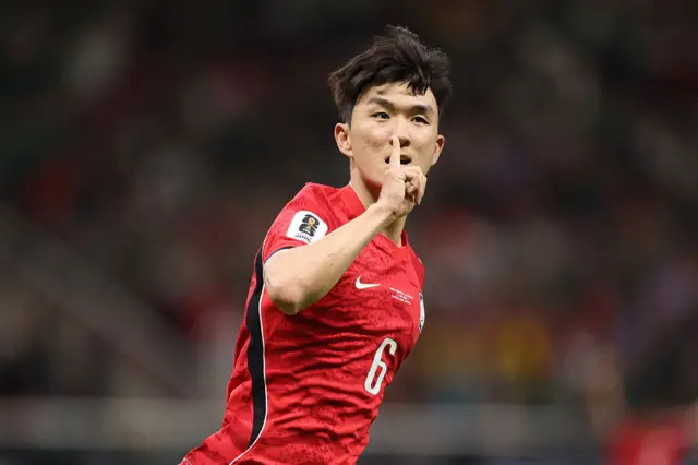 In-Beom Hwang holds his finger to his lips