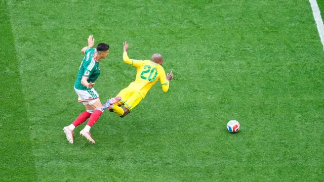 Cesar Montes of Mexico and Khuliso Mudau of South Africa compete for the ball during the FIFA World Cup 2026 Group A match between Mexico and South Africa at Mexico City Stadium on June 11, 2026 in Mexico City, Mexico.