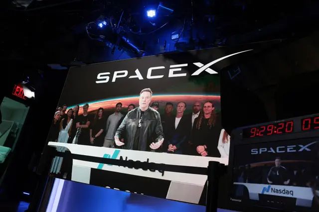 Elon Musk, founder and CEO of SpaceX, speaks via video before the ringing of opening bell at the Nasdaq Marketsite at the launch of the company's initial public offering (IPO) on June 12, 2026 in New York City.