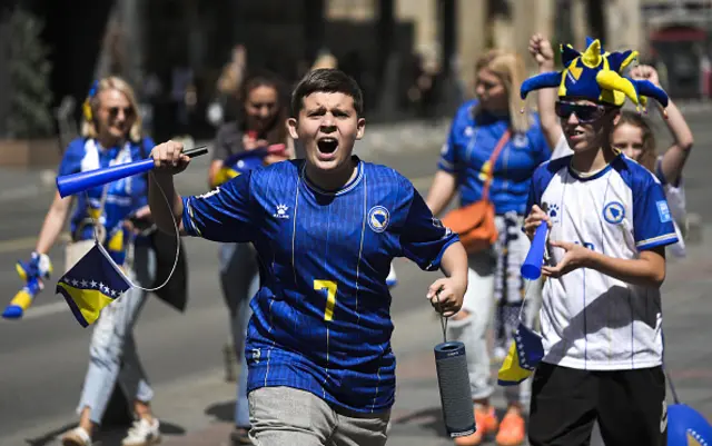 People gather on the streets with excitement ahead of the countryâs opening match against Canada