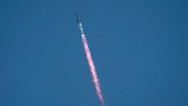 SpaceX's Starship rocket 38 launches during the 11th test flight on October 13, 2025 as seen from South Padre Island in Texas