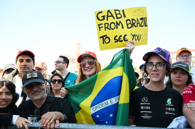 Fans hold up signs in Barcelona
