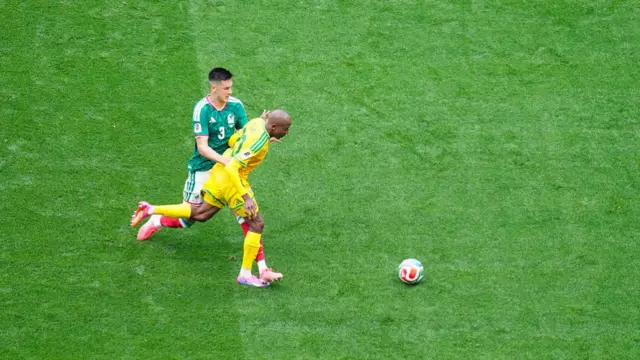 Cesar Montes of Mexico and Khuliso Mudau of South Africa compete for the ball during the FIFA World Cup 2026 Group A match between Mexico and South Africa at Mexico City Stadium on June 11, 2026 in Mexico City, Mexico.