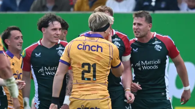 Leicester Tigers' Freddie Steward (on right) has words with Northampton Saints' Henry Pollock.