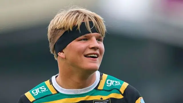 Northampton Saints' number eight Henry Pollock smiling after a match.