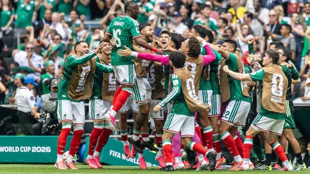 Mexico goalscorer celebrates