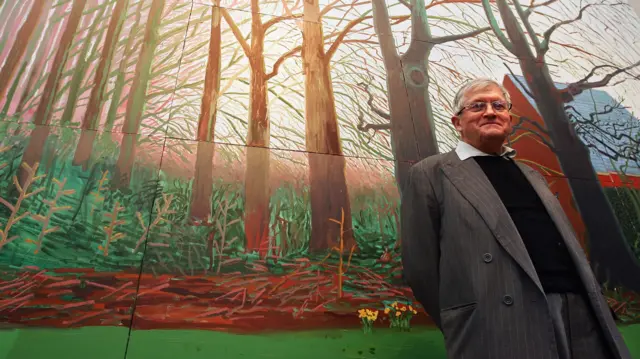 British artist David Hockney stands by his oil painting 'Bigger Trees Near Warter' on April 7, 2008 in London, England. The painting has been donated to the Tate Britain by the artist.