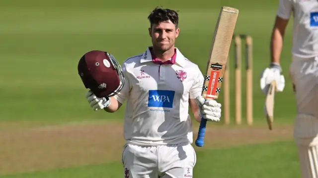 Jordan Hermann celebrates getting a century for Somerset against Notts