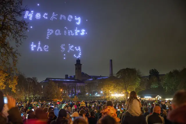 "Hockney pants the sky" lit up via drones in the night sky in Bradford as crowds look on