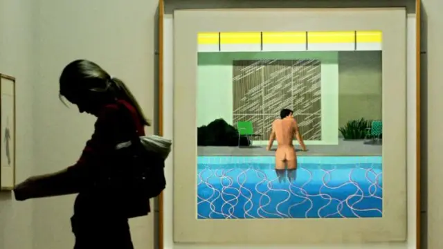 A painting entitled 'Peter Getting Out Of Nick's Pool' painted by the British artist David Hockney is pictured at the National Portrait Gallery in London, 11 October 2006.