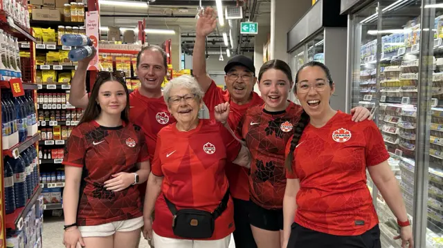 Canada fans in a supermarket