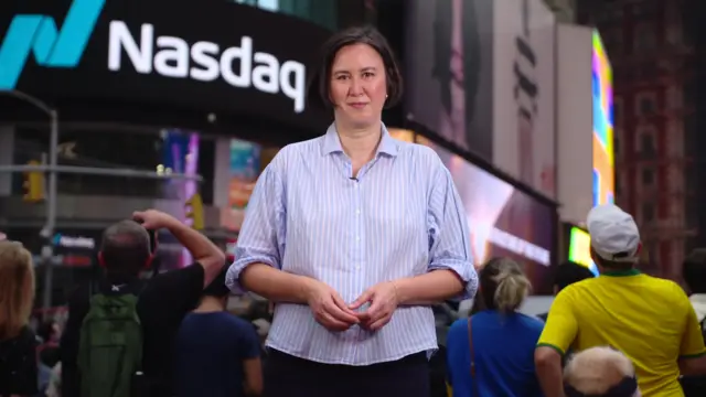 Michelle Fleury outside the Nasdaq in Times Square, New York