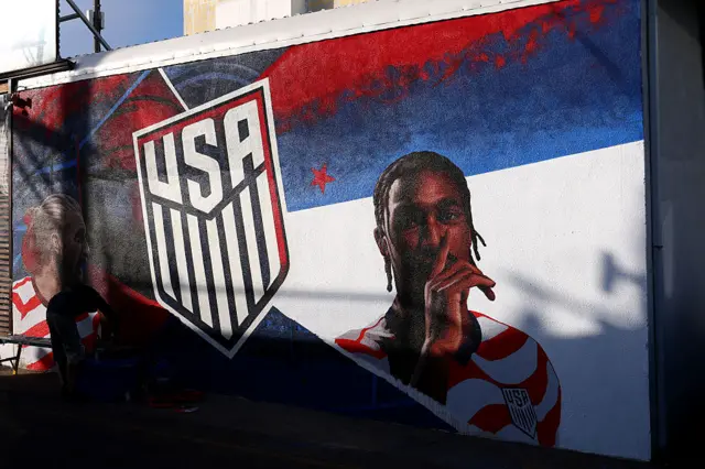 A mural of Tim Ream and Haji Wright