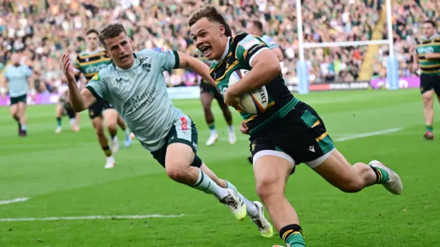 Northampton's Tom Litchfield scores a try