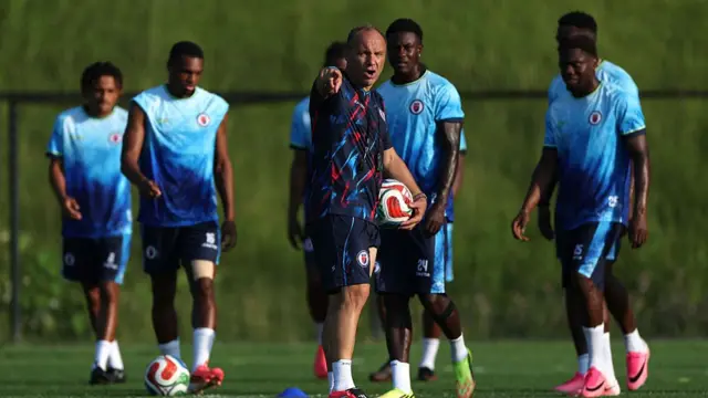 Sebastien Migne, Head Coach of Haiti, speaks with his players during the training and press conference of Haiti one day ahead of the FIFA World Cup 2026 Group C match between Haiti and Scotland at Boston Stadium on June 12, 2026 in Boston, Massachusetts