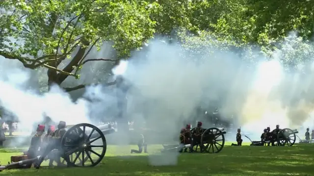 Smoke rises from a series of guns as a 41 gun salute takes place in central London