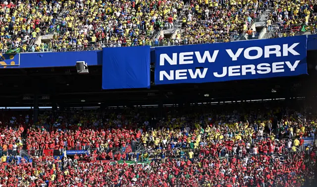 Fans of Brazil (upper tier) and fans of Morocco cheer