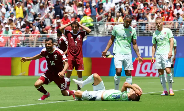 Qatar's Boualem Khoukhi celebrates scoring their first goal