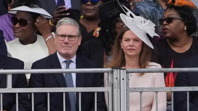 Keir Starmer and his wife Victoria Starmer sit in the crowd during the Trooping the Colour ceremony