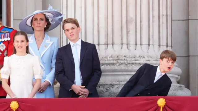 Prince Louis learns to his left as he gets a better view of the flyover. The Princess of Wales, Princess Charlotte and Prince George are also seen watching on
