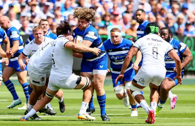 Bath's Alfie Barbeary is tackled by Tom Hooper of Exeter