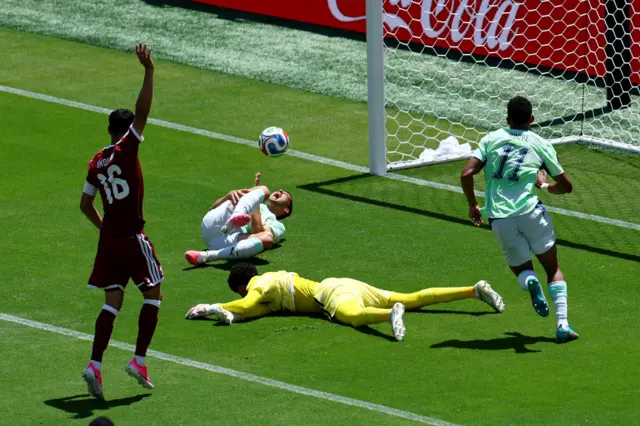 Qatar's Mahmoud Abunada reacts after he fouls Switzerland's Remo Freuler to concede a penalty
