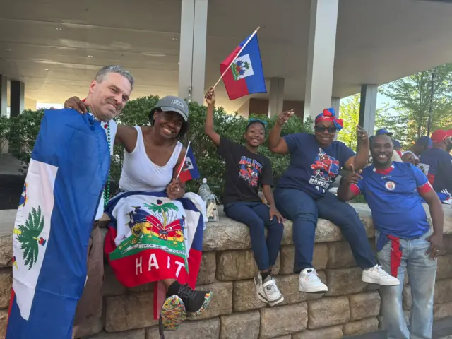Haiti and Scotland fans are mingling around the stadium