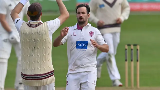 Lewis Gregory celebrates