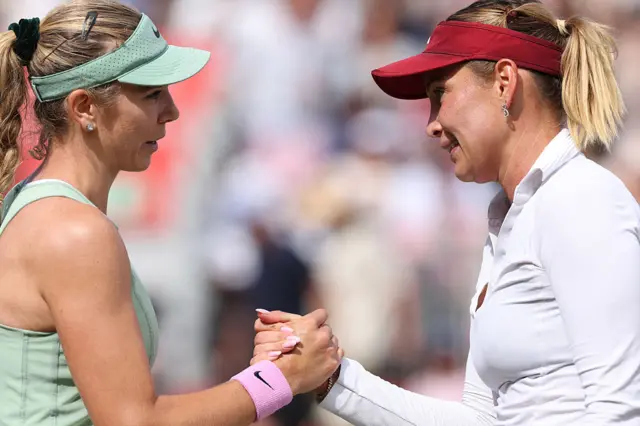 Katie Boulter shakes Donna Vekic's hand