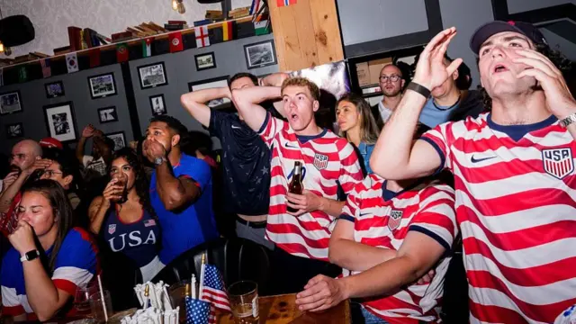USA fans react as they watch USA against Paraguay in the FIFA World Cup 2026 at The Long Acre Tavern on June 12, 2026 in New York, New York. The United States returned to the tournament in 1990 after a 40-year absence, and won only six World Cup matches in that time
