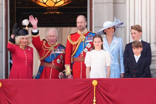 Members of the Royal Family wave from the balcony