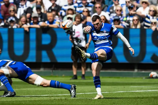 Ben Spencer of Bath Rugby kicks ahead