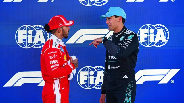 Lewis Hamilton speaking to George Russell