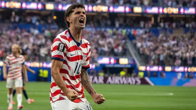 Christian Pulisic of United States celebrates their side's first goal, an own goal by Damian Bobadilla of Paraguay (not pictured), during the FIFA World Cup 2026 Group D match between USA and Paraguay at Los Angeles Stadium on June 12, 2026 in Los Angeles, California.