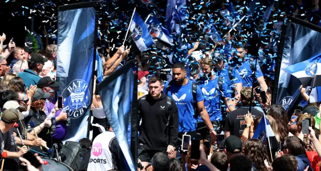 Ben Spencer, the Bath captain, leads his team through a tunnel formed by Bath supporters as they arrive at the Recreation Ground prior to the Gallagher PREM semi final match between Bath Rugby and Exeter Chiefs