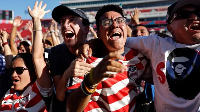 United States fans cheer after the U.S. scored the first goal in their World Cup match against Paraguay while watching the match at the FIFA Fan Festival at LA Memorial Coliseum on June 12, 2026 in Los Angeles, California. The U.S. defeated Paraguay 4-1 and Los Angeles is hosting 8 matches during the global tournament