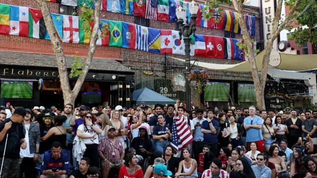 Football fans gather to watch USA and Paraguay at San Pedro Square for a FIFA World Cup watch party on June 12, 2026 in San Jose, California.