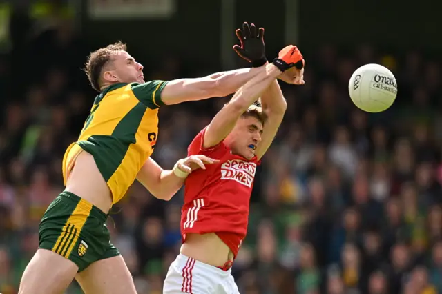 Ian Maguire and Jason McGee battle for the ball