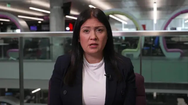 Lisa Nandy is pictured speaking during a live television interview with the BBC. She is in the Salford newsroom and wearing a dark jacket over a white top.