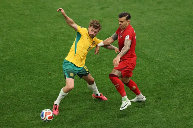 Connor Metcalfe #8 of Australia controls the ball against Caglar Soyuncu #4 of Turkiye during the FIFA World Cup 2026 Group D match between Australia and Türkiye at BC Place Vancouver