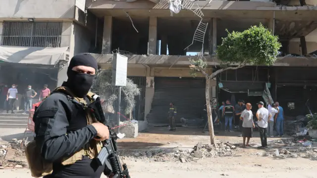 Lebanese security forces at the site of an Israeli airstrike on 14 June
